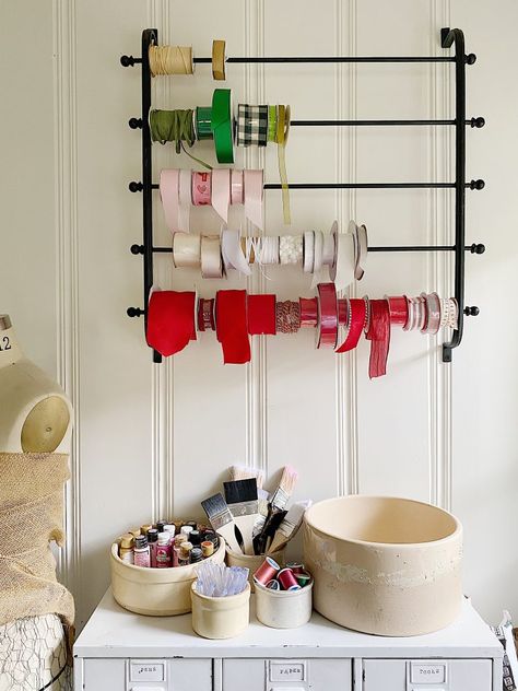 How to Organize Ribbons in Your Craft Room | My 100 Year Old Home  I love my craft room. The biggest challenge isn't doing the crafts. It's keeping all of my supplies organized. Today I am sharing how to organize ribbons in your craft room. #farmhouse #craftroom #ribbon #craftribbon #craftorganization #organizationtips #crafts #diy #my100yearoldhome Organizational Wall, Wrapping Paper Wall, 100 Year Old Home, Ribbon Wrapping, Farmhouse Office Decor, Ribbon Holders, Ribbon Organization, Ribbon Wall, Ribbon Storage