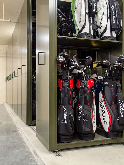 A planned community in Florida uses high-end golf bag storage to create a comfortable and convenient guest experience. Check it out! #cleverstorage #storageexperts #golfstorage Golf Club Storage, Athletic Storage, Golf Bag Storage, College Storage, Sports Equipment Storage, Garage Storage Inspiration, Mobile Shelving, Planned Community, Country Clubs