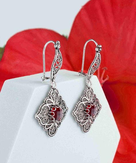 Dangle a little magic from your ears with these handcrafted Ruby Gemstone 925 Sterling Silver Earrings from FiligranUSA 🌹 With artisan filigree art and an ornate paisley design, they're a blend of elegance and bohemian chic. Perfect for making a sophisticated statement at any event! Tap into your inner enchantress and elevate your jewelry game. ✨ Click the link to adorn your lobes with these beauties ➡️ https://nuel.ink/GavyGV #RubyElegance #SilverSensation #HandcraftedGlam #FiligranUSAFind... Ruby Quartz, Female Earrings, Paisley Art, Gemstone Drop Earrings, Artisan Earrings, Filigree Design, Sterling Silver Filigree, Paisley Design, Ruby Gemstone