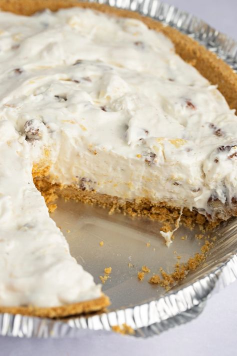 This millionaire pie is rich, sweet, and so decadent! With a graham cracker crust and cream cheese and pineapple filling, it tastes like a million bucks! Furrs Millionaire Pie Recipes, No Bake Millionaire Pie, Millionaire Pie With Cream Cheese, Million Dollar Pie With Cream Cheese, Almond Cream Pie, Yum Yum Pie Recipe, Pies In Graham Cracker Crust, Cream Pies With Graham Cracker Crust, Furrs Millionaire Pie