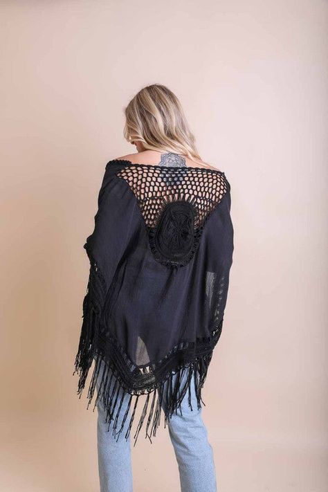 Crochet Medallion Tassel KimonoHas Arm HolesImmediate ShippingOne Size Fits MostSizes 0-18Back Length: 45 in (including tassel)Bust Across: 49 in (including both side tassels)Armhole: 14.5 inTassel Length: 9.5 in Style: Kimono Print / Pattern: Crochet Medallion Fit: Loose Sleeve: Mid Sleeve Length: Mid Length Made In: ChinaFabric Contents: 100% PolyesterNon-stretch fabricSize Measurement (inch):One Size: 49.0 (Bust), (Waist), (Hips), 45.0 (Length) Crochet Medallion, Crochet Kimono, Poncho Jacket, Beach Kimono, Lace Kimono, Bohemian Look, Boho Kimono, Long Kimono, Black Crochet