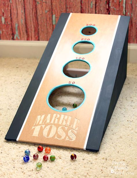 A fun DIY marble toss game that will keep the kids busy for the rest of the summer. An easy game to make using workshop scraps and a Dremel Fortiflex. #DremelMaker Tossing Games, Toss Game Diy, Game Diy, Playground Games, Marble Games, Diy Marble, Bag Toss, Scrap Wood Projects, Toss Game