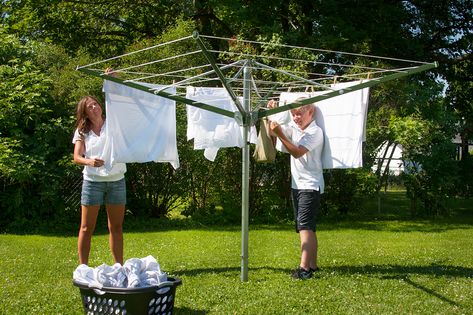 At G & G Clothesline we manufacture Clotheslines and Dryers that are durable, fold up for storage, are assembled and fully roped. Our Sunshine Clothesline was patented in 1915 and built ever since. Over the years it has been upgraded as ideas and technology have improved. We make them in Parkersburg IA with people who are proud of the Sunshine Clothesline name.  We are also proud that we build a product that helps conserve energy by using renewal resources to perform a continually needed task. Outdoor Clothes Dryer, Spinning Outfit, Washing Clothes By Hand, Outdoor Clothes Lines, Clothes Lines, Aquaponics Fish, Small Yards, Fashion Umbrella, Clothes Drying