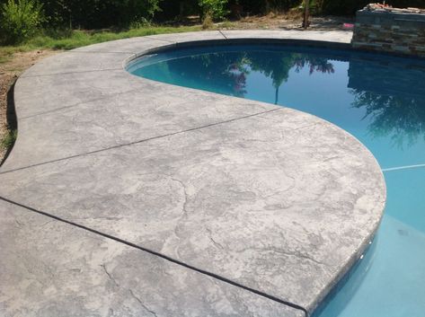 Textured Concrete Pool Deck, Cool Decking Pool Colors, Pool Concrete Deck Ideas, Concrete Around Pool Ideas, Stamped Concrete Around Pool, Concrete Pool Coping, Concrete Around Pool, Slate Stamped Concrete, Pool Hardscape