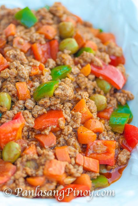 PORK GINILING KALDERETA ==INGREDIENTS== 1½ lbs. ground pork, 1 (8 oz.) can tomato sauce, 1 small red bell pepper, 1 small green bell pepper, ½c carrots, ¼c liver spread, ¼c green olives, 1 piece pork cube, ½c water, 3T cooking oil, 1 small yellow onion, 4 cloves garlic, ½t crushed red pepper flakes, salt and pepper to taste   =========== Pork Giniling Recipe, Kaldereta Recipe, Giniling Recipe, Filipino Pork Recipes, Ground Pork Recipes, Pinoy Food, Filipino Recipes, Ground Pork, Pork Dishes