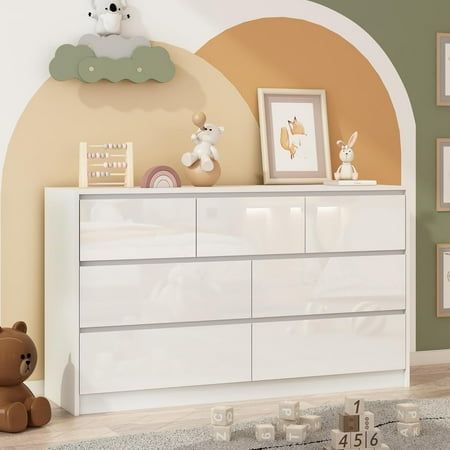 About this item Different from ordinary long chests of drawers, our white 7 drawers dresser for bedroom has a high-gloss front, adding a charming touch to your room. The unique beveled design of the drawers is full of modern elements. This high gloss dresser can be matched with various themed homes Overall dimensions55.1"D x 15.7"W x 31.5"H. Drawers dimensions: 26.8"D x 11.8" W x 8.7"H and 17.8"D x 11.8" W x 8.7"H. There are 4 large and 3 medium drawers to easily organize your belongings and hel High Gloss Dresser, Free Dresser, Dresser For Kids, Malm Dresser, Large Chest Of Drawers, Long Living Room, Long Dresser, Bedroom Chest Of Drawers, Dresser For Bedroom