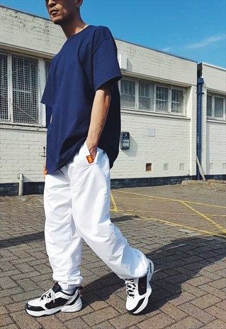 NEW FMC BAGGY TRACKIES WHITE [TRACKSUIT-TRACKIE-BOTTOMS] White Joggers Outfit Men, Baggy Tracksuit Outfit, White Tracksuit Outfit, White Joggers Outfit, Black Sweats Outfit, Groovy Fits, Sweatpants Aesthetic, Athleisure Streetwear, Baggy Tracksuit