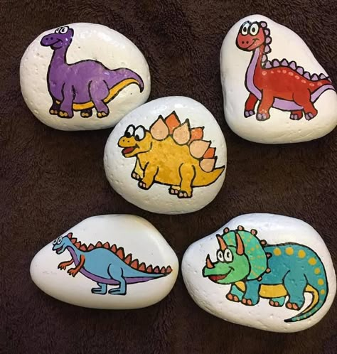 Painted Rocks Dinosaur, Rock Painting Ideas Dinosaur, Dinosaur Rock Painting Ideas, Dinosaurs Painted On Rocks, Dinosaur Rocks, Dinosaur Rock Painting, Dinosaur Party Activities, Happy Rock, Rock Gifts