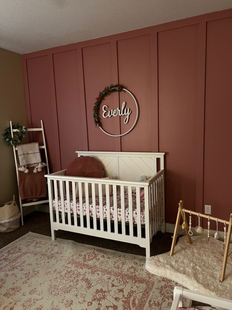 We did the accent wall ourselves with 1 in x 2 in strips of wood from home depot. The paint color is “cherry juice” from behr. Behr Cherry Juice, Maroon Accent Wall Bedroom, Accent Wall Baby Girl Nursery, Moody Pink Nursery, Cherry Wood Nursery, Wood Accent Wall Nursery, Maroon Accent Wall, Dark Pink Nursery, Baby Girl Nursery Accent Wall