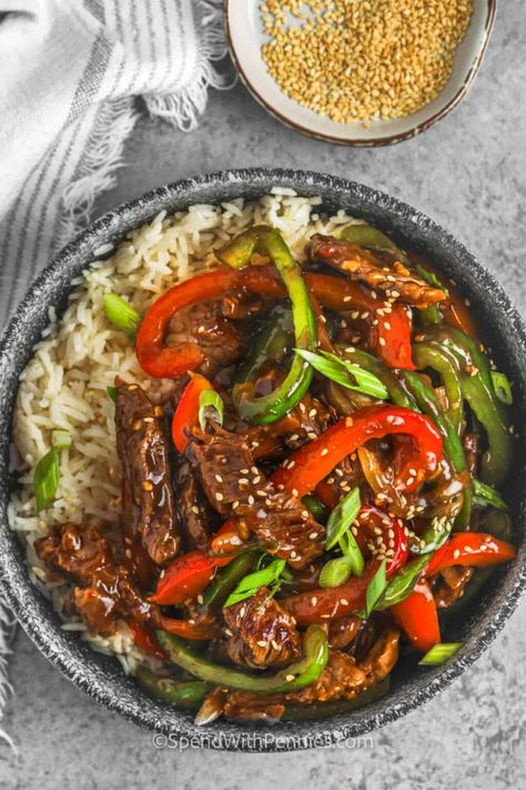 Serve this juicy and tender pepper steak as a main dish for dinner tonight. Bell peppers, onions, and some sliced steak are pan-fried in some oil and then simmered in a thickened Chinese sauce. This is so easy to make and would taste good served with some broccoli or over a bed of rice. #peppersteak #peppersteakrecipe #easypeppersteak #spendwithpennies Peper Steak, Pepper Sauce For Steak, Beef Pepper Steak, Steak Dinner Ideas, Easy Beef Stir Fry, Szechuan Beef, Chinese Pepper Steak, Steak Stir Fry, Pepper Steak Recipe