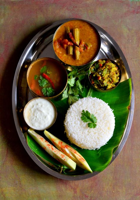 The staple food of Tamilnadu is Rice. We usually have rice for lunch along with some gravy made with lentils, rasam, stirfried vegetables called poriyal in Tamil or kootu i.e vegetables and lentils are cooked together & semisolid in consistency and finally curd. These 4 items are must in our lunch menu. Healthy Food For Dinner, Cooking Recipes Veg, Food For Dinner, Indian Food Photography, Rice Recipes For Dinner, State Foods, Easy Rice Recipes, Recipes In Tamil, Food Critic