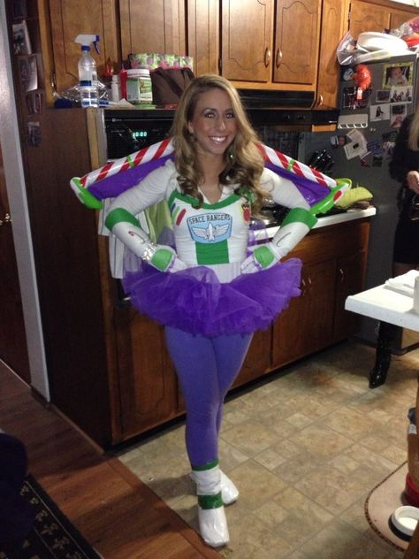 Home made buzz lightyear costume for women. Just wore a white long sleeve shirt and purple leggings. Covered an old pair of boots with duct tape and bought the tutu, wings, and gloves. The top is a white tank top, bound the buttons online, printed them and glued them to craft foam paper and hot-glued to the tank. I sewed the green edging around the top. Diy Buzz Lightyear Costume, Make At Home Halloween Costumes, Disfraz Buzz Lightyear, Buzz Costume, Buzz Lightyear Halloween Costume, Lightyear Costume, Sew Halloween Costume, Buzz Lightyear Costume, Toy Story Halloween