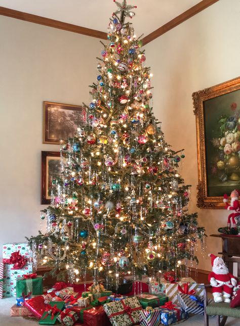 Icicle tinsel on a 12’ Christmas tree!  I️ wanted a tree to remind me  of my childhood and I️ think got pretty close.  Icicle tinsel is the best! Christmas 2017 Tinsel Strands Christmas Tree, Vintage Christmas Tinsel Tree, Christmas Tree Tensile, Tinsel Icicles On Christmas Tree, Hanging Tinsel On Tree, Vintage Tree With Tinsel, Christmas Tree With White And Colored Lights, Tinsel Tree Vintage, Christmas Tree With Tinsel Icicles