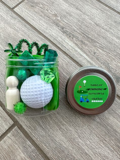 Golf ball and play dough in a jar with other sensory items Top Golf Party Favors, Golf Goodie Bag Ideas, Goodie Bag Ideas, Playdough Party, Personalized Birthday Favors, Golf Theme Party, Golf Party Favors, Par Tee, Golf Birthday Party