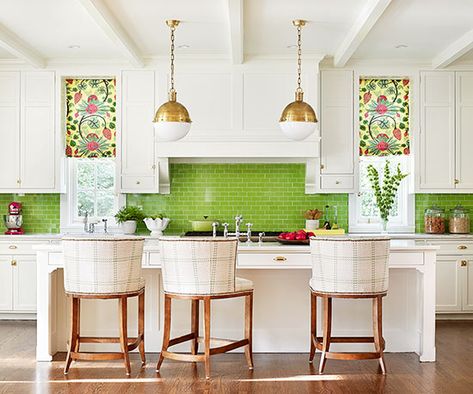 Offset a crisp all-white kitchen with a statement-making green blacksplash. The symmetry of the glass tiles is continued in the room's furniture and lighting. Colorful Kitchen Backsplash, Patterned Window Treatments, Green Subway Tile, Green Backsplash, Colorful Backsplash, White Kitchen Ideas, Green Tiles, Kitchen Design Color, Farmhouse Sinks