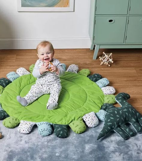 How To Make Playmat with Dino Pillow and Overalls Online | JOANN Dinosaur Playmat, Playmat Diy, Diy Baby Play Mat, Play Mat Pattern, Dino Pillow, Play Mat Diy, Educational Playroom, Round Play Mat, Baby Floor Mat