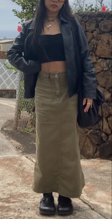 Army green cargo skirt outfit, black leather jacket, crossbody bag, birkenstock boston clogs styled, black boston clogs outfit, layered necklaces, layered jewelry, sunglassws, collored sunglasses, black tube top, ootd, day fit, rings, style inspo, spring fashion trends, spring 2023, thrifted outfit, thrifting inspo, thrifting, thrifted, trendy outfit, maxi skirt, midi skirt, long skirt Long Green Cargo Skirt Outfits, Long Skirt And Jacket Outfit, Maxi Green Skirt Outfit, Army Green Maxi Skirt Outfit, Long Tube Skirt, Casual Green Cargo Skirt, Dark Green Maxi Skirt Outfit, Green Cargo Maxi Skirt Outfit, Army Green And Black Outfit