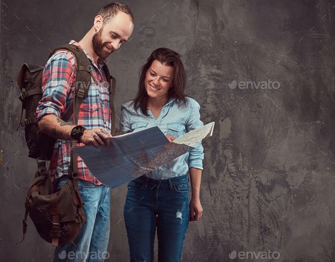 Studio portrait of male and female tourists with backpack and map, standing in a studio. by fxquadro. Studio portrait of male and female tourists with backpack and map, cuddling in a studio. Isolated on a gray background. #Sponsored #tourists, #backpack, #map, #female Studio Portrait, Poses References, Anatomy Art, Male And Female, Studio Portraits, Gray Background, Creative Business, Anatomy, Art Reference