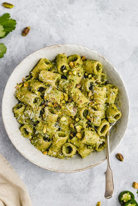 Flavorful cilantro pistachio pesto made with fresh cilantro, roasted pistachios, garlic, lime juice and a kick of heat from jalapeño. This easy pistachio pesto recipe comes together in just five minutes and is delicious on pasta, chicken, fish and more. Skip the store bought pesto for good! #pesto #pistachios #vegan #dairyfree #cilantro #sauce Roasted Pistachios, Healthy Pesto, Cilantro Pesto, Pistachio Recipes, Pistachio Pesto, Pasta Chicken, Cilantro Sauce, Ambitious Kitchen, Healthy Comfort Food