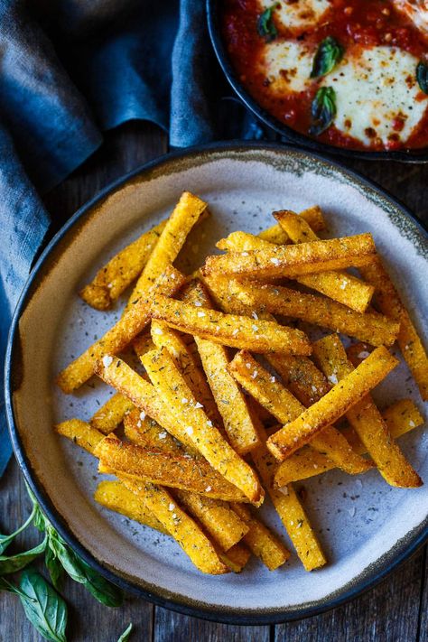 Crispy air fryer Polenta Fries! Whether you enjoy them as a snack, side dish, or appetizer, these polenta fries offer a delightful twist on a classic favorite. Give them a try and savor their crispy, tender goodness! Vegan and Gluten-free. (Directions for conventional oven included.) Air Fryer Polenta, Fried Polenta Recipes, Crispy Polenta, Polenta Frita, Salty Recipes, Baked Polenta, Feasting At Home, Polenta Fries, How To Cook Polenta