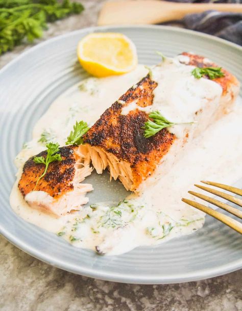 Dairy-free Pan Seared Salmon in Cream Sauce (Paleo, Whole30) | A crispy pan seared salmon slathered in a rich coconut cream sauce seasoned with fresh parsley, lemon and nutmeg. Gluten-free, Grain-free, Paleo, Whole30 Jamaican Salmon Recipe, Salmon In Cream Sauce, Lemon Sauce For Salmon, Sauces For Fish, Paleo Sauce, Coconut Cream Sauce, Salmon With Cream Sauce, Paleo Salmon, Seared Salmon Recipes