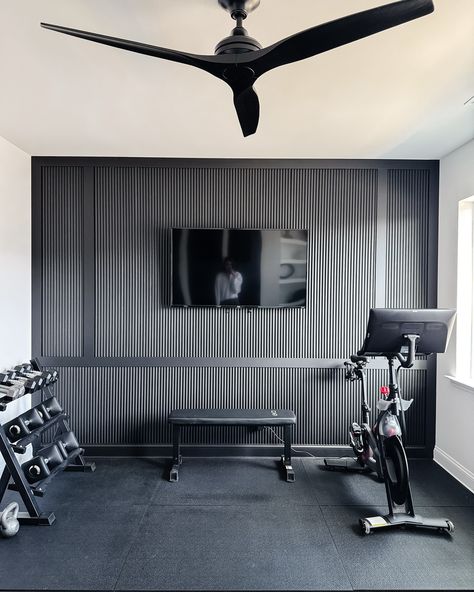 Reeded moulding for a unique take on board and batten in this home gym makeover #homegym #homegymmakeover #roommakeover #diyhousetohome #diytogether #diyaccentwall #accentwall #featurewall #reededwall #blackaccentwall #modernhomedesign #moderninteriors #moderninteriordesign #tricornblack #matteblack #mattefinish #designisinthedetails #interiordetails #itsallinthedetails Home Gym Accent Wall, Reeded Moulding, Gym Makeover, Exercise Rooms, Black Accent Walls, Diy Accent Wall, Wall Finishes, Board And Batten, Modern Interior Design