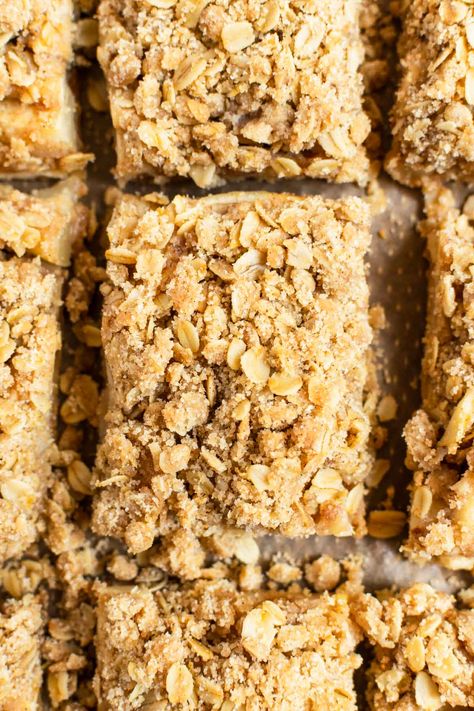 Apple crisp bars pair buttery brown sugar shortbread crust and cozy apple pie filling with a rich oatmeal crisp topping. These bars are bursting with fall flavors and warm, welcoming spices that will leave you savoring every last morsel. #applecrispbars #applecrisp #appledessert #applerecipe #dessert #falldessert #fallbaking Apple Crisp Bars, Brown Sugar Shortbread, Oatmeal Crisp, Crisp Topping, Apple Pie Filling, Shortbread Crust, Fall Flavors, Apple Pies Filling, Apple Desserts