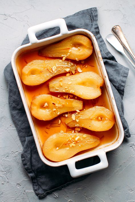 Pears roasted in a maple ginger syrup and served with a dollop of coconut cream. It's sweet, gingery, and super easy to make! Roasted Pears, Roasted Pear, Baked Pears, Ginger Syrup, Pear Recipes, God Mat, Fruit Recipes, Vegan Desserts, Ingredients Recipes