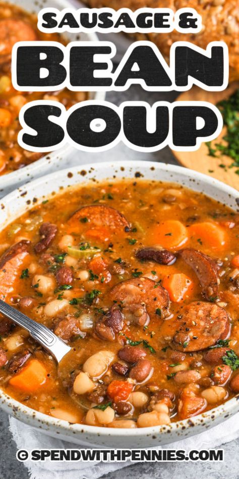 The sight of this bean soup with smoked sausage simmering on the stove is sure to make everyone hungry. With the help of Hambeen's 15-bean soup mix, this soup is sure to be packed full of color and flavor. With black beans, red and white kidney beans, yellow split peas, and more, this soup mix is the perfect addition to any soup. A recipe like this is perfect for when winter is knocking at the door! #beansoupwithsmokedsausage #beansoup #beansouprecipe #spendwithpennies 6 Bean Soup, Multi Bean Soup, Polish Sausage Soup Recipes, 16 Bean Soup Recipe Stove Top, Bean Chowder Recipe, Kalbasa Soup Recipe, Creamy Bean Soup, Hamburger Bean Soup, 15 Bean Soup Recipe