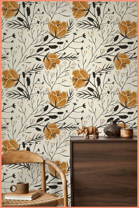 Floral wallpaper with mustard and black flowers behind a wooden cabinet and chair. Peel And Stick Wallpaper Boho Nuwallpaper, Peel And Stick Bohemian Wallpaper, Bold Wallpaper Bedroom Farmhouse, Peel And Stick Wallpaper Laundry Room Bohemian, Western Boho Wallpaper For Living Room, Target Peel And Stick Wallpaper Living Room, Best Removable Wallpaper The Home Depot, Vinal Wallpaper Boho, Target Removable Wallpaper Accent Walls