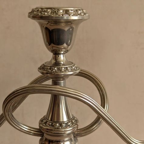 AVAILABLE ✨Silver Plated Ianthe 3-Cup Candelabra, Vintage Mid-Century✨ A lovingly polished silver plated candelabra with twisty arms and floral detailed edges. Likely c. 1950s-70s. In great condition, nice weight. Would look excellent on a mantel or centered on a dining room table. Height: 25.5cm (10") Width: 26cm (10.25") Diameter of base: 10cm (just under 4") 💸 price and more details/photos on website 🇬🇧 FREE UK p+p #collectedvintage #vintageseller #vintagecollection #curatedvintage #ig... Candelabra Vintage, Vintage Interiors, Curated Vintage, Shop Interiors, Table Height, Room Table, Dining Room Table, Vintage Collection, Interior Styling