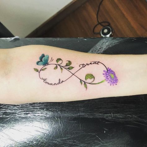 Butterfly Infinity Tattoo Ideas, Orchid Infinity Tattoo, Flower Infinity Tattoo Design, Butterfly Tattoo With Name In The Middle, Infinity Butterfly Tattoo For Women, Friend Infinity Tattoos, Butterfly Family Tattoo, Infinity Tattoo With Flowers, Butterfly Infinity Tattoo