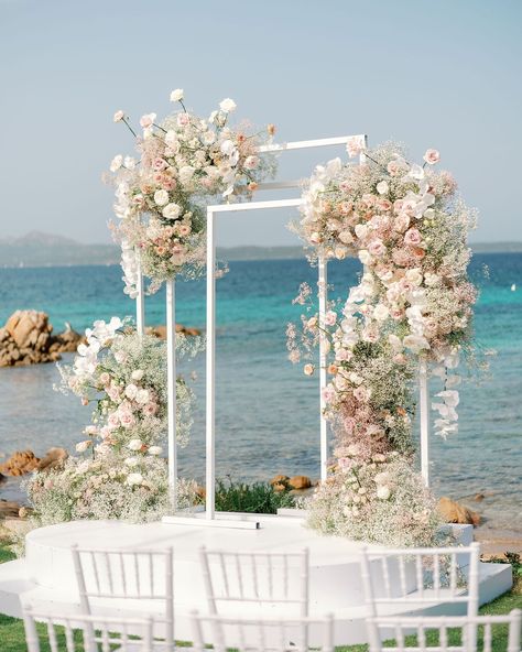 A Seaside Wedding in Sardinia Featured Pastel Tones✨ Denise and Paul celebrated their love with a picturesque wedding in Sardinia, an island they both cherish deeply. Their wedding in a private garden overlooking the beach embodied glamour and romance, featuring soft pastel decorations inspired by the delicate beauty of clouds. @sara_carboni_events masterfully orchestrated the event, ensuring every detail reflected the couple’s vision and exceeded their high expectations, making the day tru... Pastel Decorations, Beachfront Wedding, Shoes Ysl, Story Planning, Backdrop Frame, Wedding Beach Ceremony, Pastel Decor, Luxury Destinations, Seaside Wedding