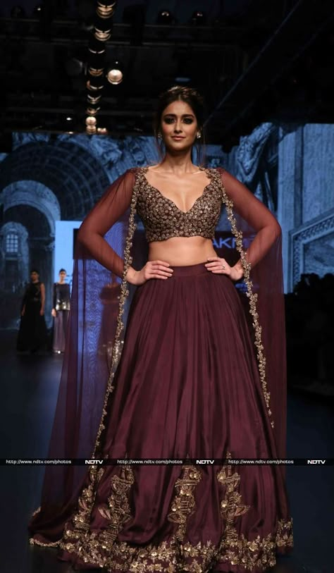 Actress Ileana D' Cruz looked lovely in a wine coloured lehenga. She was the show stopper for designer Ridhi Mehra's show.