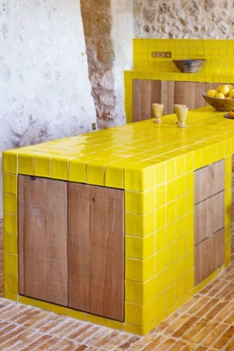 Acid Yellow glazed field tiles and special tiles featured in french kitchen island and kitchen backsplash. #newterracotta #glazedtiles #kitchendesign #yellow Yellow Tiled Kitchen, Tiled Kitchen Island, Tile Kitchen Island, French Kitchen Island, Terracotta Kitchen Tiles, Mallorca House, Terracotta Kitchen, Sealing Grout, New Terracotta