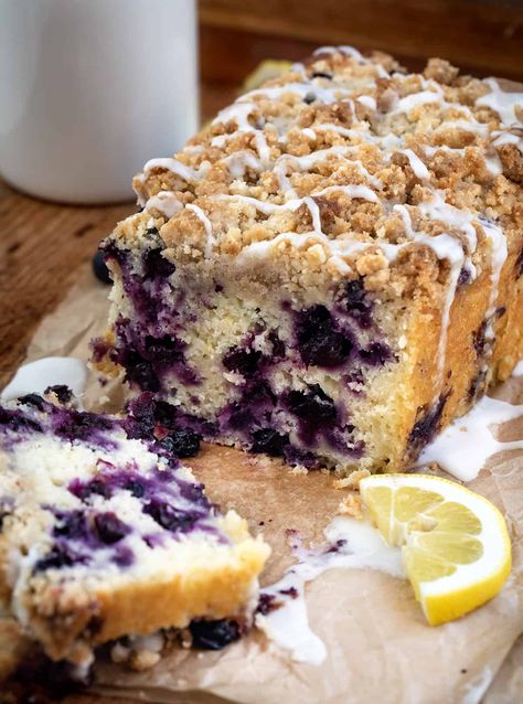 Blueberry Lemon Loaf is a moist cake-like loaf loaded with fresh blueberries and lemon flavor, topped and baked with a crumble topping. Then, the loaf is drizzled with a sweet glaze to make this a perfect breakfast, snack, or dessert. This is a copycat of the viral Costco Blueberry Lemon Loaf and dare I say, even BETTER!! Blueberry Crumble Coffee Cake, Berry Coffee Cake, Blueberry Buckle Cake, Blueberry Buckle Recipe, Lemon Blueberry Pound Cake, Lemon Blueberry Loaf, Blueberry Crumb Cake, Blueberry Pound Cake, Blueberry Buckle