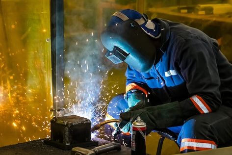 Male working with a welding torch | Free Photo #Freepik #freephoto #welding #metal-work #welder #metal-industry Environment Portrait, Welding Works, Shielded Metal Arc Welding, Welding Services, Arc Welding Machine, Robotic Welding, Welding Technology, Metal Art Decor, Welding Torch