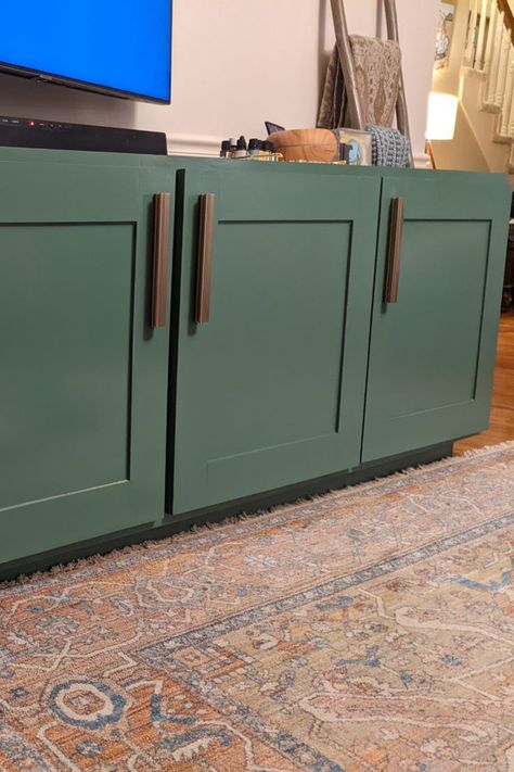 basil green credenza is the main focus with shaker doors and burnished brass pulls.  rust colored rug in the foreground. Credenza Living Room, Diy Credenza, Long Credenza, 80s House, Furniture Build, Woodworking Projects Diy, Projects Diy, Lumber, Credenza