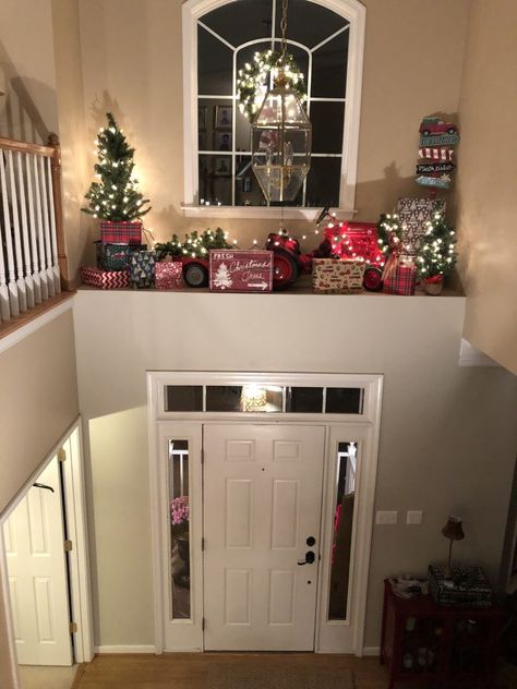 Christmas Decor On Banister, Above Door Ledge Decor, Foyer Ledge Decorating Ideas Christmas, Foyer Over Door Decor, Christmas Inside Decor Ideas, How To Decorate High Ledges, High Shelf Christmas Decorating, Decorate Ledges In Home, Pony Wall Christmas Decor