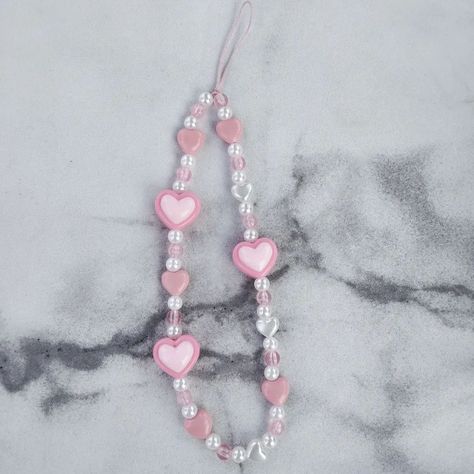 Pink phone strap 🫶🏻🌷💕🎀🌸 Only 15k . . . . #phonestrap #phoneaccesories #beadphonestrap Phonestrap Ideas, Chunky Jewellery, Charm Ideas, Keychain Ideas, Manik Manik, Beaded Strap, Pink Phone, Strap Phone, Chunky Jewelry