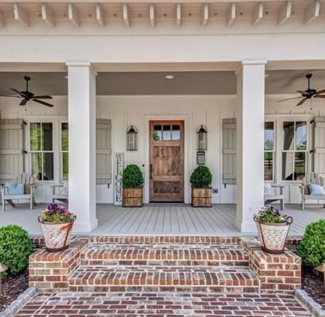 Front Porch Column Ideas Farmhouse, Front Porch Floors Ideas, White House With Wood Pillars, Farmhouse Exterior Entryway Ideas, Two Step Front Porch, Tan Farmhouse Exterior, Brick Steps Front Porch Entrance, Front Porch White House, Brick Steps Front Porch