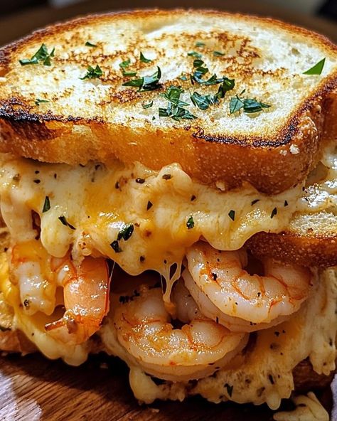 Cheesy Garlic Bread Shrimp Grilled Cheese 🥪🧄🍤: Ingredients For the Garlic Bread: 1 loaf French bread, sliced in half lengthwise 4 tablespoons unsalted butter, softened 3 cloves garlic, minced 1 teaspoon dried parsley 1/2 teaspoon dried basil 1/4 teaspoon salt For the Shrimp: 1/2 lb large shrimp, peeled and deveined 1 tablespoon olive oil 1 teaspoon paprika 1/2 teaspoon garlic powder 1/2 teaspoon onion powder Salt and pepper to taste For the Grilled Cheese: 8 slices of your favorite cheese (s... Cheesy Pizza, Breaded Shrimp, Cheesy Garlic Bread, Crab Recipes, Food Therapy, Cheese Bread, Food Tasting, Quick Dinner Recipes, Quick Dinner