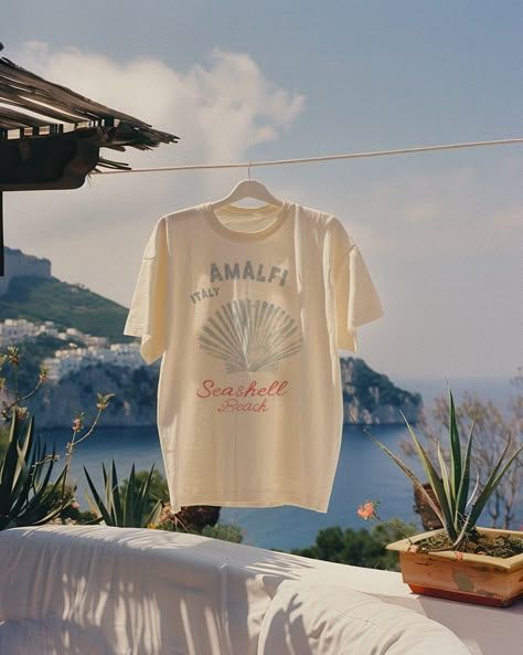 Found Amalfi’s best-kept secret ~ a vespa ride through Positano and a hidden cliff trail led us to a nameless beach, which I now call Seashell Beach 🐚🍋🐟 Surf Graphic Tee, Beach Graphic Tee, Graphic Tee Outfit Aesthetic, Shell Tshirt, Seashell Graphic, Obx Outfits, Beach Shirt Design, Italy Pattern, Beach Mood