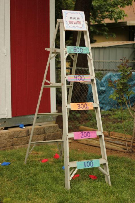 Carnival Party - Beanbag toss - Took a ladder and assigned each rung an amount of points. Could have made cute beanbags, but I bought them instead. Tombola Ideas, Beanbag Toss, Repurposed Ladders, Diy Carnival Games, Backyard Carnival, Carnival Signs, Fall Festival Games, Carnival Games For Kids, Fall Carnival