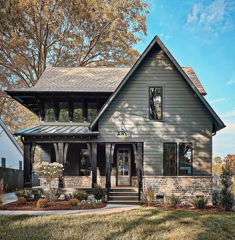 Farmhouse Homes 🏡 on Instagram: “We are LOVING this unique rustic farmhouse exterior! 💚 The unique dark green color is so perfect, and we love the stone work at the…” Green House Exterior, Brown Roof, Gray House, Cabin Exterior, Dark House, Exterior Paint Color, Casas The Sims 4, Unique Farmhouse, Exterior Paint Colors For House