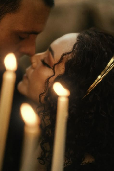 Close up photo of two peoples face close in proximity. In the forefront there is a candelabra creating a soft warm glow and in the background slightly out of focus is the couple stopping just shy of a kiss. Gothic Engagement Photos Ideas, Spooky Couple Aesthetic, Victorian Engagement Photos, Dark Romantic Wedding Photos, Graveyard Couples Photoshoot, Dark Romance Photoshoot, Dark And Moody Engagement Photos, Gothic Couple Photoshoot, Fantasy Engagement Photos