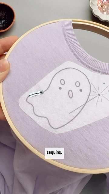 Laine Irene on Instagram: "Mini sequin tutorial ✨

Comment SEQUIN if you want a direct link to my full length YouTube tutorial on adding sequins to a project and let me know if you have any questions below! 
.
.
.
#sequins #spookyseason #embroiderytutorial #ghostie" Diy Sequin Embroidery, How To Embroider Sequins, How To Sew On Sequins, Sequin Tutorial, How To Sew On Sequins Tutorials, How To Sew Sequins Tutorials, Halloween Hand Embroidery Sweatshirt, Diy Sequin Patches, How To Embroider A Ghost