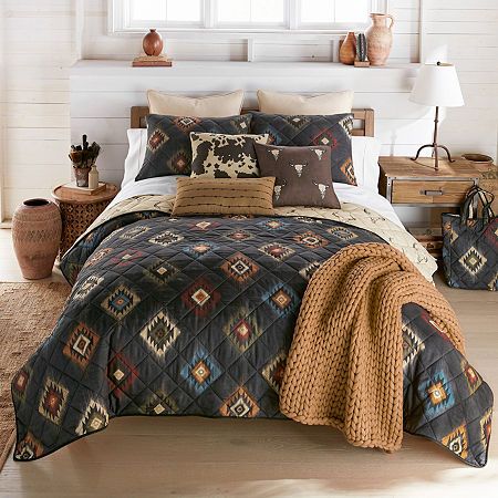 Elevate your bedroom decor with the striking beauty of the southwest with your lifestyle by donna sharp's phoenix light weight quilt set. The phoenix quilted bedding collection showcases sketched; diamond-shaped southwest motifs meticulously arranged in an overall repeat pattern. This exquisite design captures the essence of traditional southwestern aesthetics, offering a blend of timeless charm and modern elegance. With a palette inspired by earthy hues of the southwest, this quilt set boasts a Phoenix Quilt, Southwest Bedding, Cattle Skull, Quilted Bedding, Western Bedding, Striking Beauty, Western Bedroom, Ivory Background, Cozy Quilts