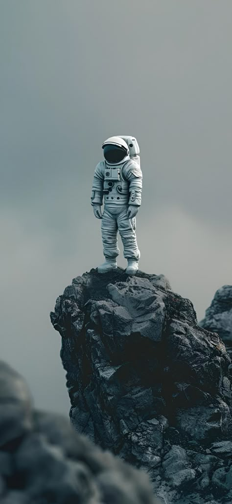 Discover the essence of exploration. Save & follow for more cosmic vibes. An astronaut stands, a beacon of adventure, atop a rugged peak. The horizon fades from light to dark gray, embodying the serene yet unknown vastness of space. It’s a call to the bold and the brave. Own this moment of tranquility and ambition. #explore #space #astronaut #cosmic #adventure #imageprompt #Aiimage Astronaut Standing, Black Hd Wallpaper Iphone, Nasa Wallpaper, Space Iphone Wallpaper, Qhd Wallpaper, Rocky Hill, Iphone Wallpaper Lights, Iphone Dynamic Wallpaper, Astronaut Wallpaper