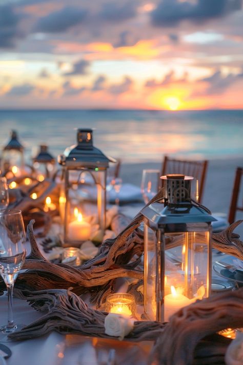 Capture the essence of love with these breathtaking wedding centerpieces. A blend of rustic driftwood and luminous lanterns create an unforgettable seaside ambiance 🌊🕯️. Perfect for brides dreaming of a beach-themed celebration 🏖️✨. #WeddingInspiration #BeachWedding #RomanticDecor #LanternCenterpieces #DriftwoodDecor #WeddingIdeas #Tablescapes #EveningGlow Beach Reception Centerpieces, Driftwood Wedding Centerpieces, Ocean Centerpieces, Beach Theme Backyard, Nautical Wedding Centerpieces, Driftwood Wedding, Boho Centerpiece, Beach Centerpieces, Driftwood Centerpiece